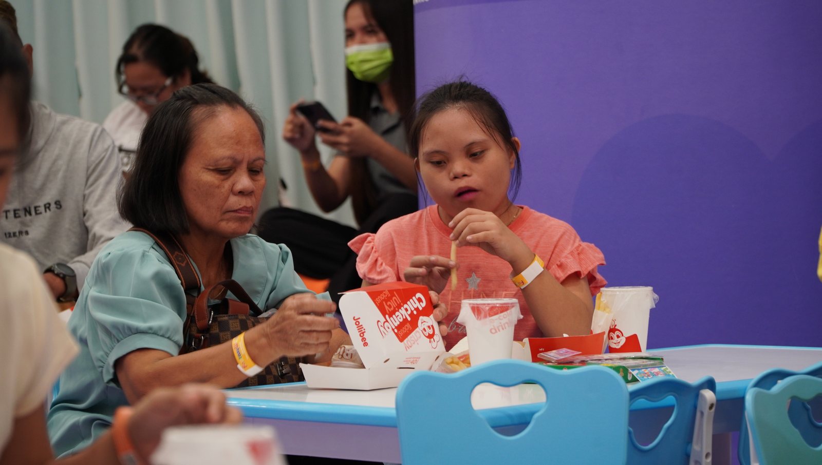 Sharing snacks at one of the tables.