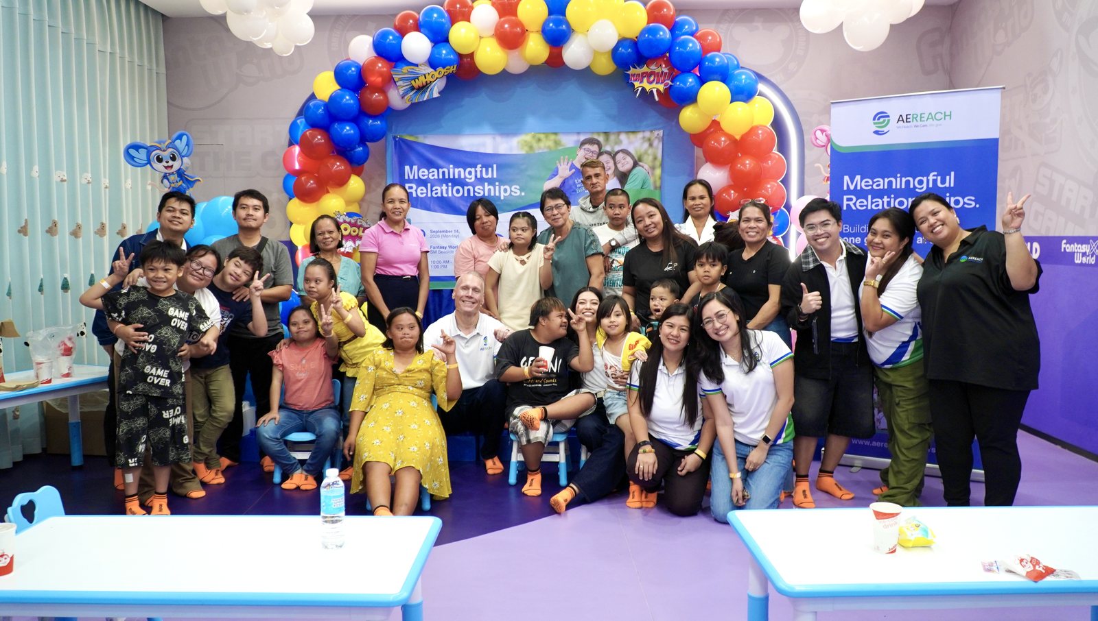 The whole gathering together under the Meaningful Relationships banner.