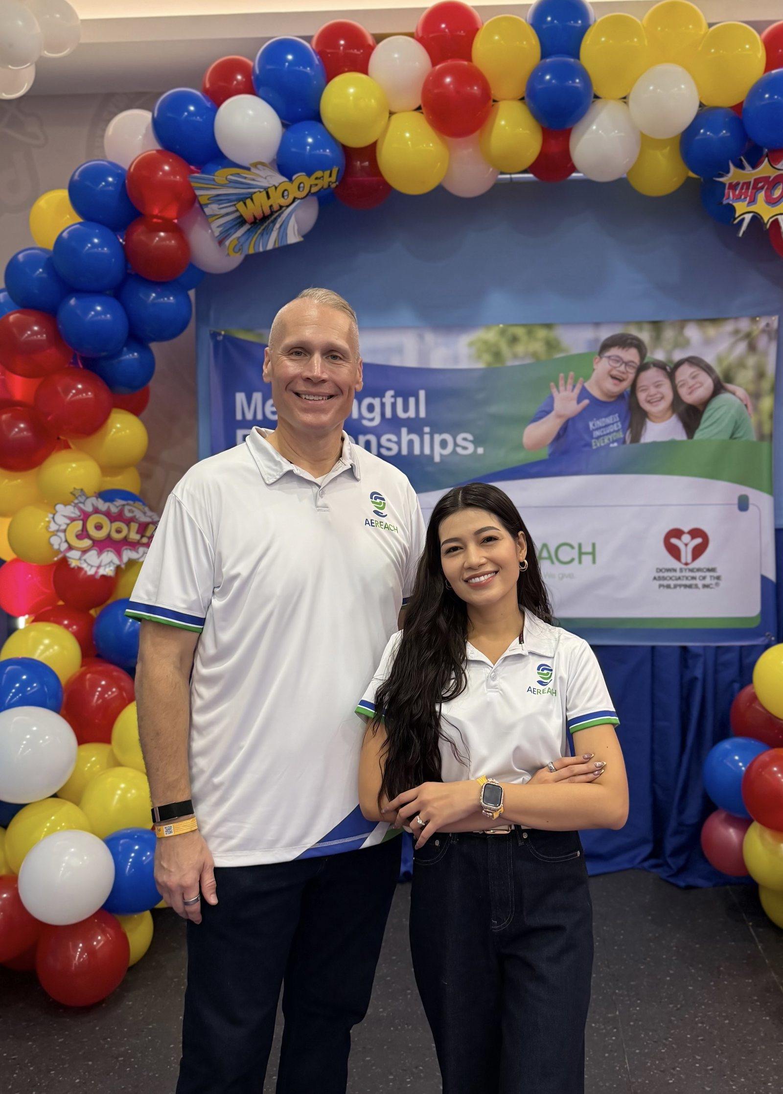 Tim Bonnell and a volunteer by the event banner.