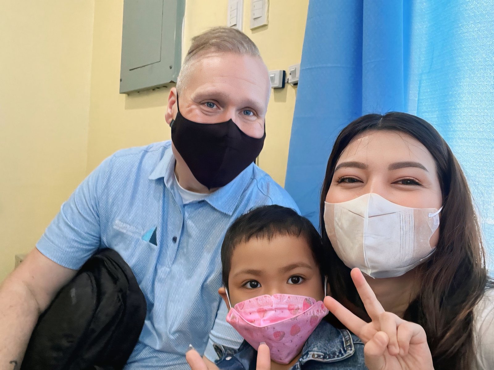 Tim Bonnell and a volunteer with one of the children.