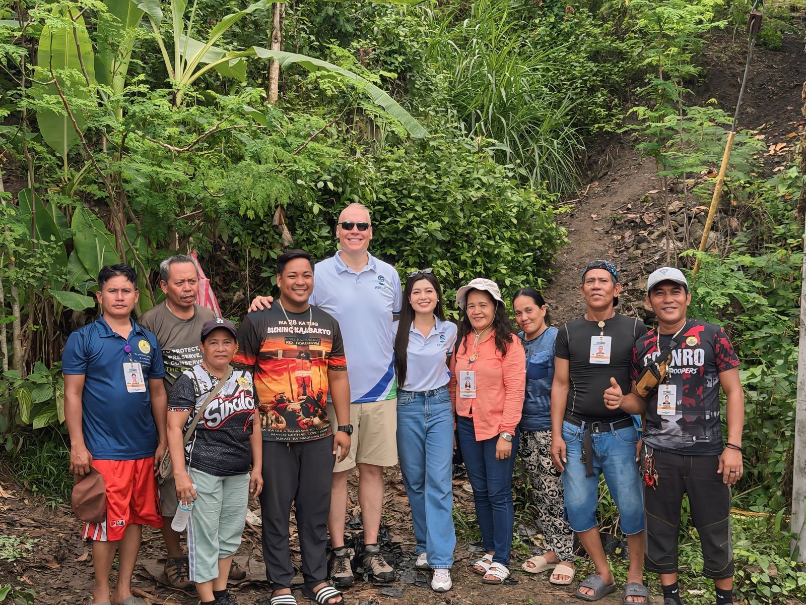 The planting group gathered on the hillside.